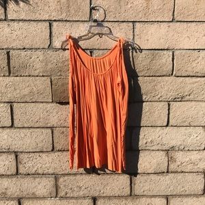 Orange top with peep shoulders